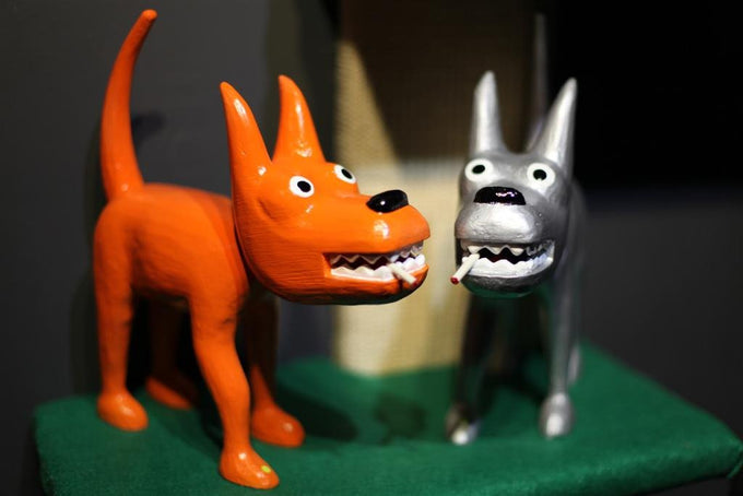 101 Show Orange And Silver Dog Sculptures