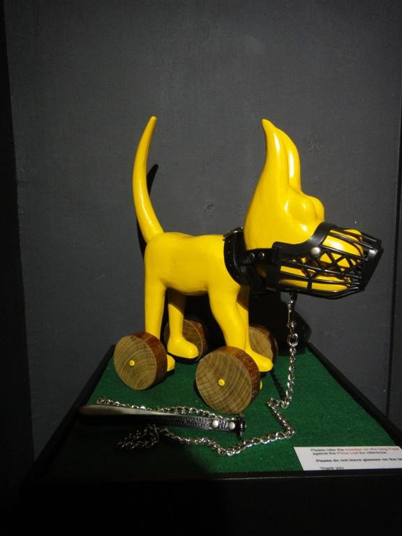 101 Show Yellow Dog Sculpture With Wheels